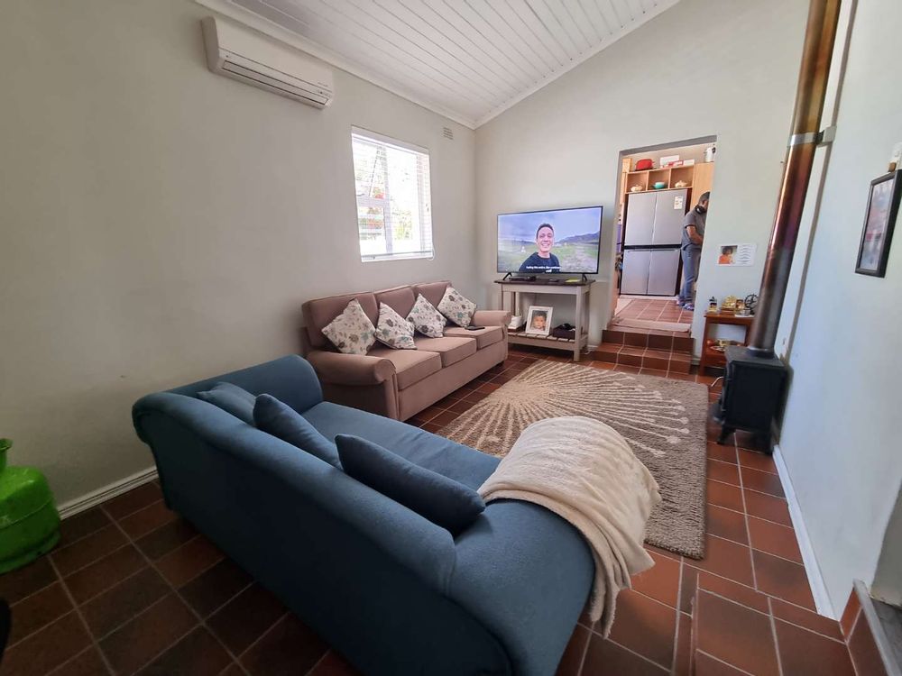 Family TV room with fire place. Cosy and comfy.