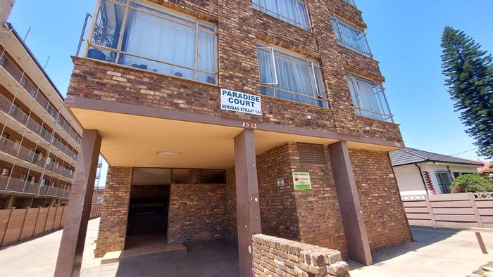 Spacious Pretoria West apartment for sale: 1.5 bedrooms, prepaid power, parking.