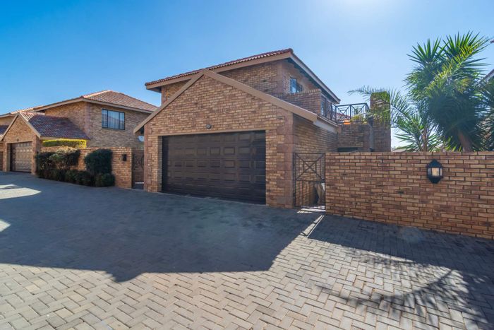 For Sale: Willowbrook Townhouse with garden, patio, pool, and 24/7 security.