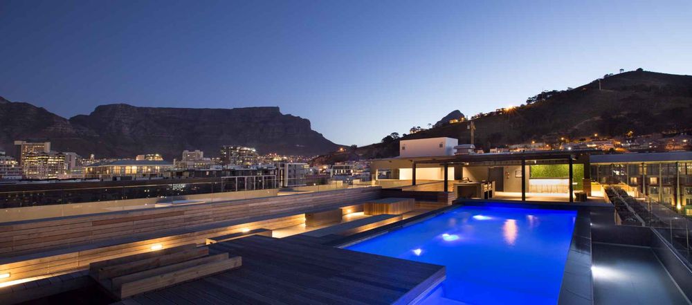 rooftop pool deck with 360 degree views, gas barbecues and private bar
