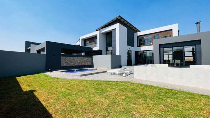 For Sale: House in Midstream Heights with pool, indoor braai, and park views.