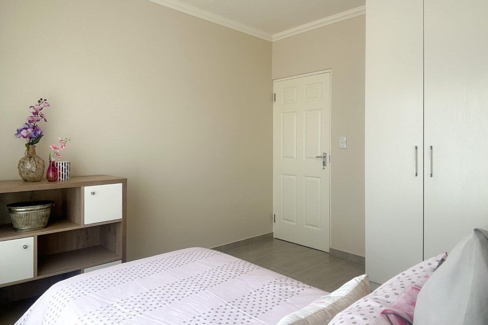 Third bedroom with built-in cupboards.