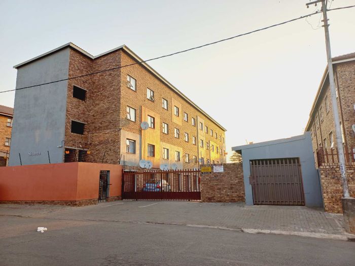2-Bedroom Apartment For Sale in Kempton Park AH with garage and essential amenities.