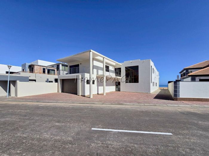 For Sale: Beachfront House in Long Beach with 4 Bedrooms, Multiple Living Areas.