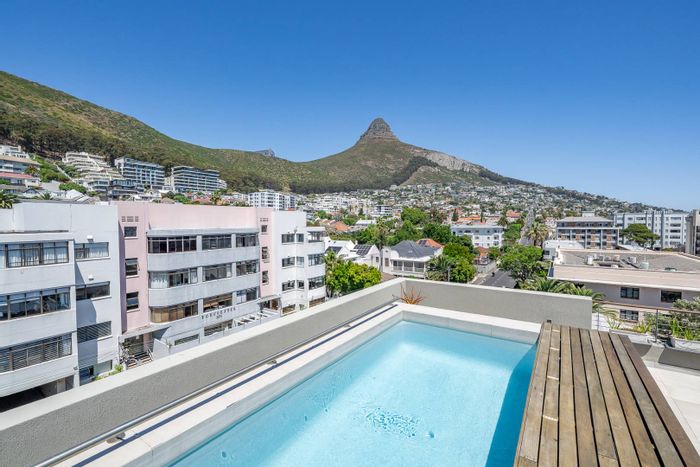Sea Point Apartment For Sale: 2 beds, rooftop pool, private outdoor area, 2 parking.