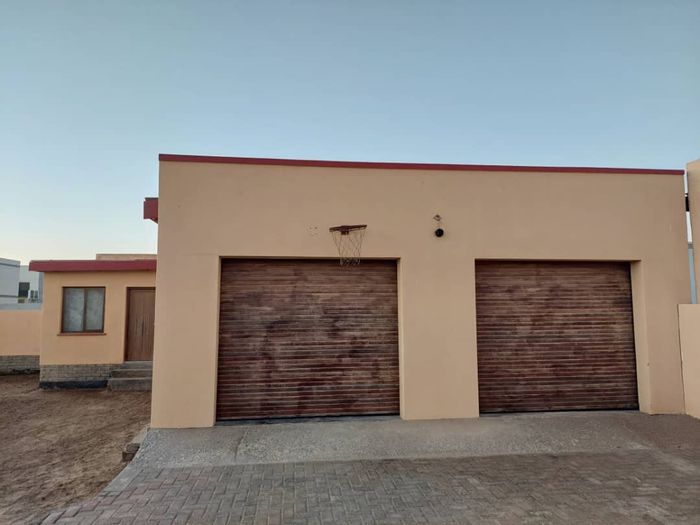 For Sale: House in Walvis Bay Central with large yard, double garage, and flat.