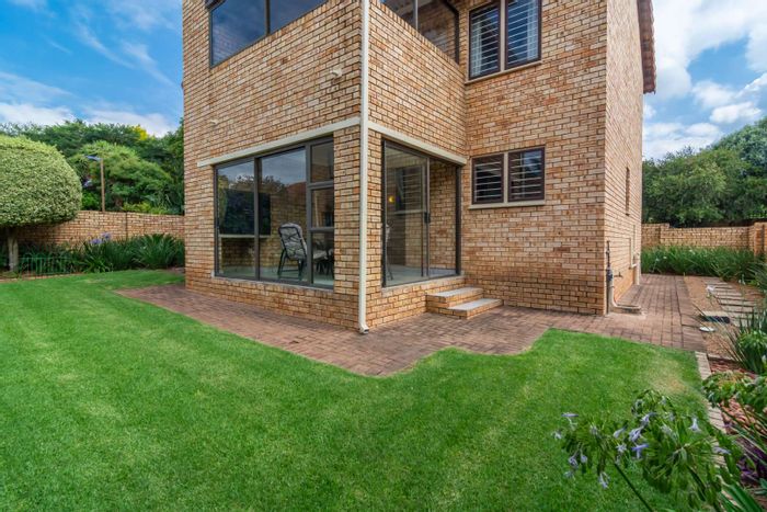 For Sale: 4-Bedroom Townhouse in Ruimsig with garden, garage, and security features.