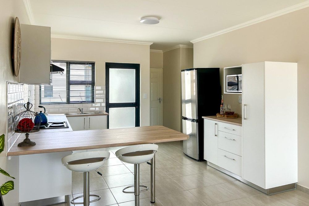 Kitchen with plenty of built-in cupboards and a built-in oven.