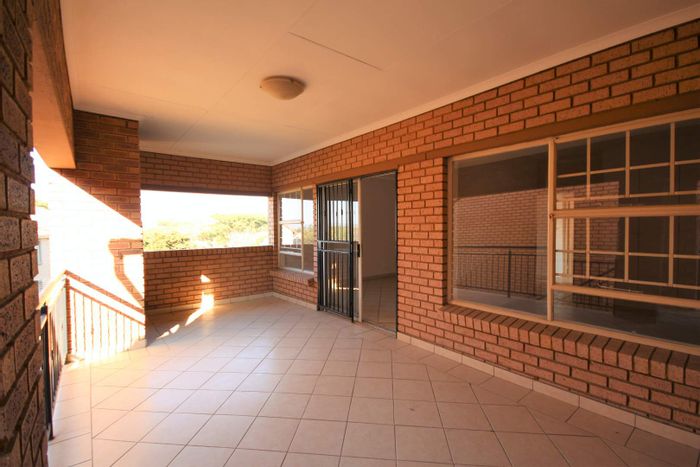 2 Bedroom Apartment To Rent in Hazeldean with Garage, Patio, and Security Features.