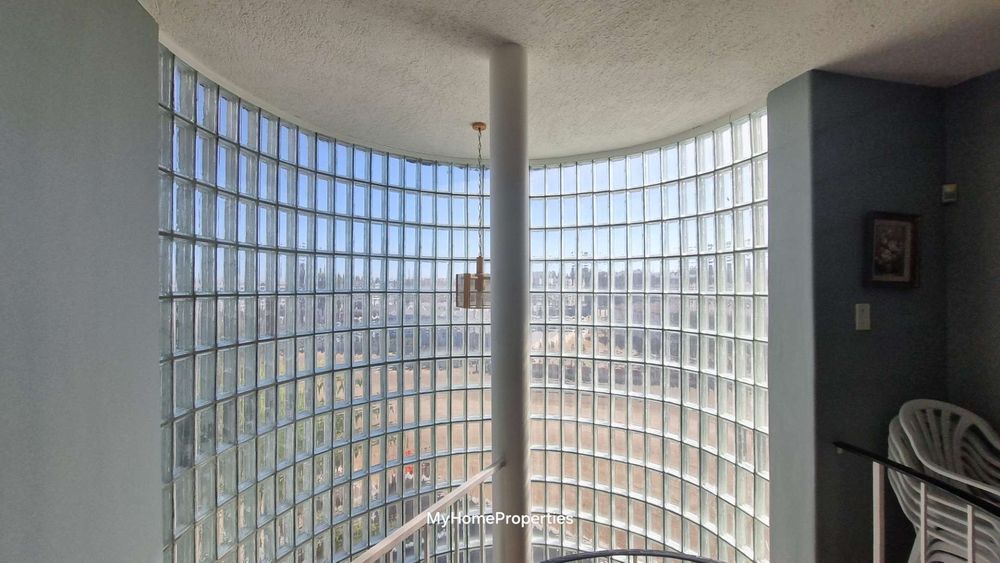 Glass window by spiral staircase