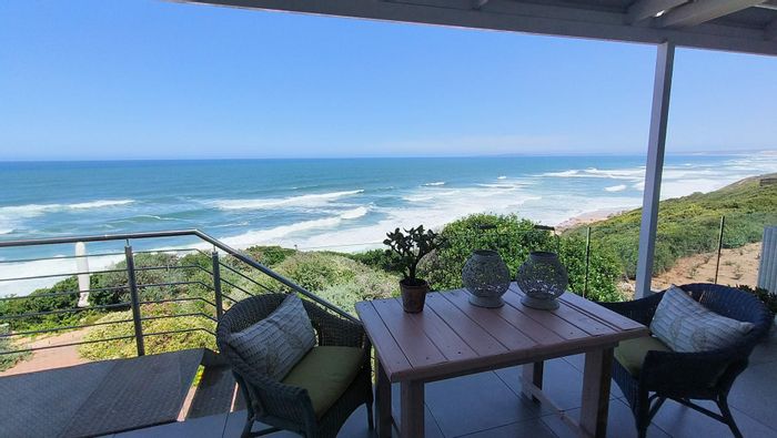 Oceanfront house in Dana Bay for sale: beach access, spacious living areas, panoramic views.