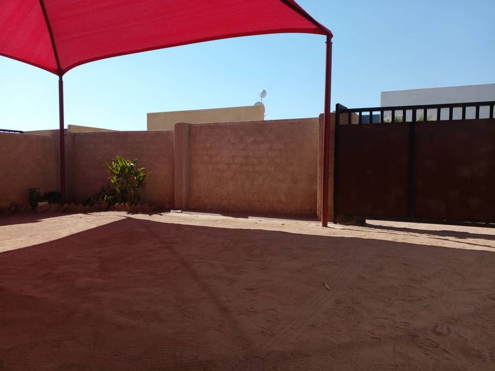 General view of shade-net parking area to the front courtyard 