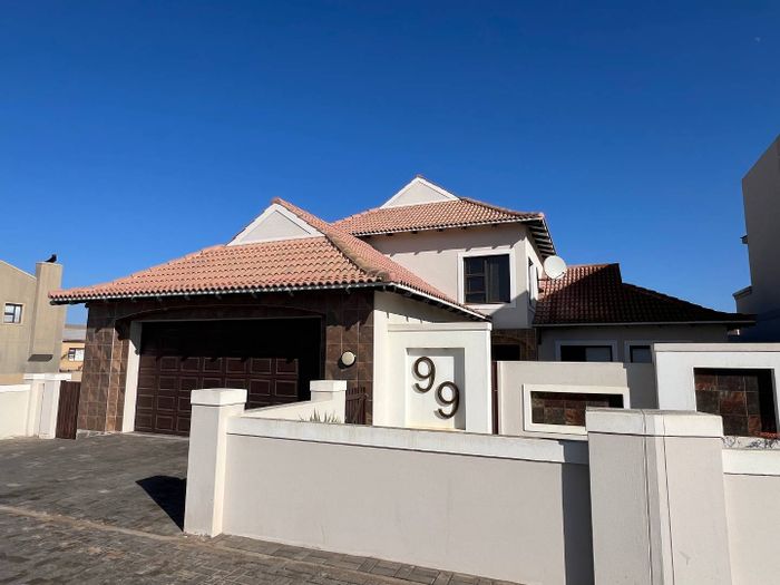 For Sale: 4-Bedroom House in Long Beach with spacious yard and double garage.