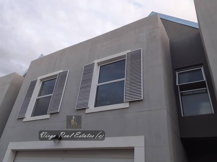 For Sale: 3-Bedroom Townhouse in Avis with security, garage, and entertainment area.