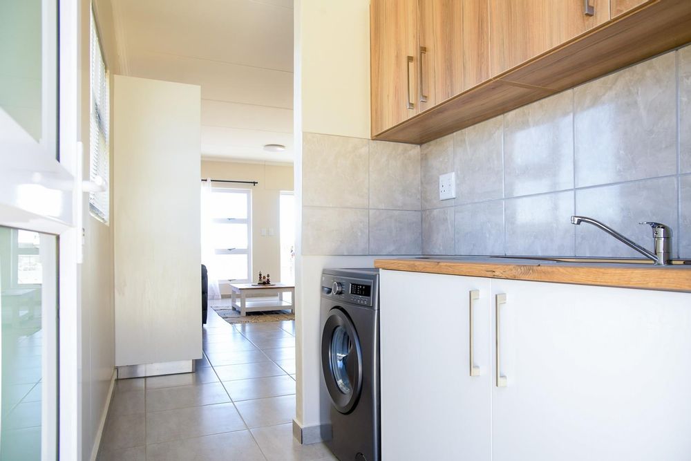 Kitchen scullery with even more cupboards.