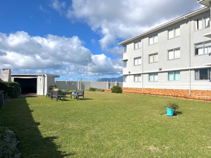 For Sale: Apartment in Muizenberg Central with Airbnb potential, communal garden, and secure access.