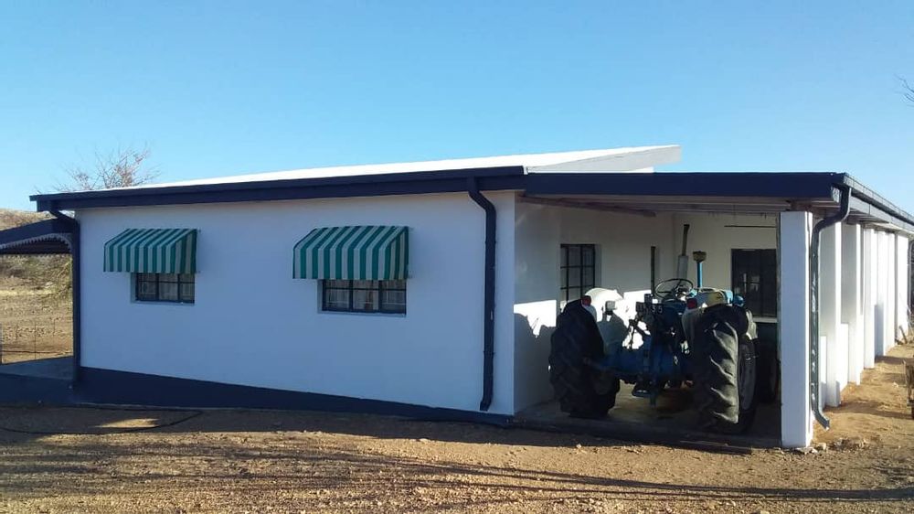 Additional side view of the second house. Space to park tractor under roof