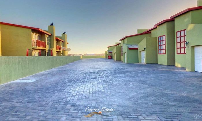 Ocean View Townhouse For Sale: 2 Bedrooms, Courtyard, Open-Plan Living, Garage.