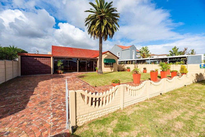 Spacious Bothasig Home with Garden, Sunroom, and Braai Room - For Sale!