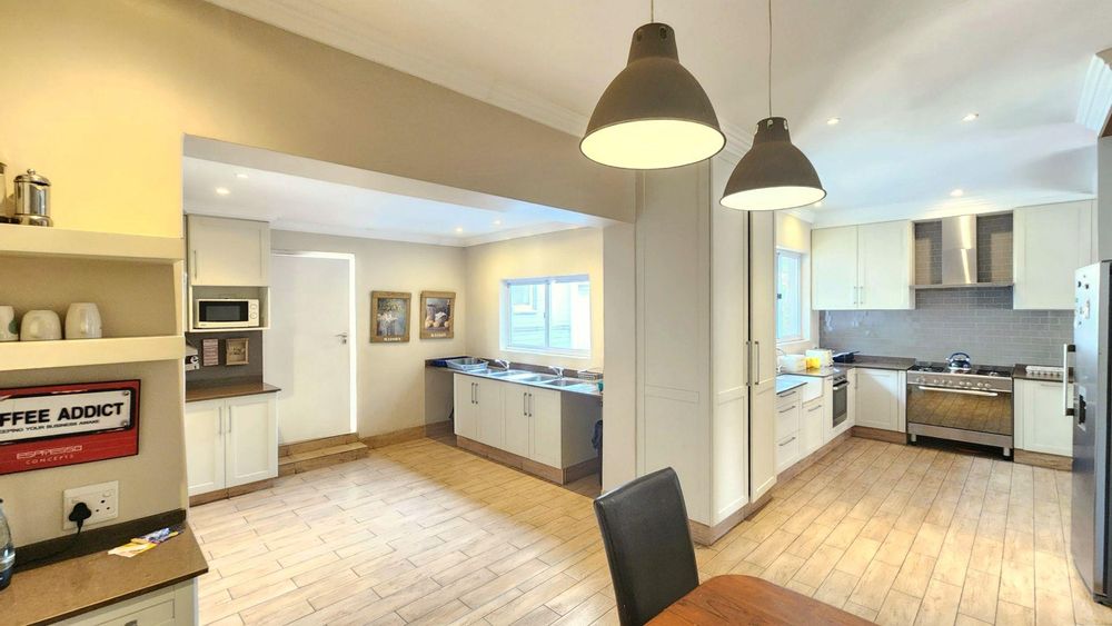 View of two sides of the kitchen from the kitchen dining space.