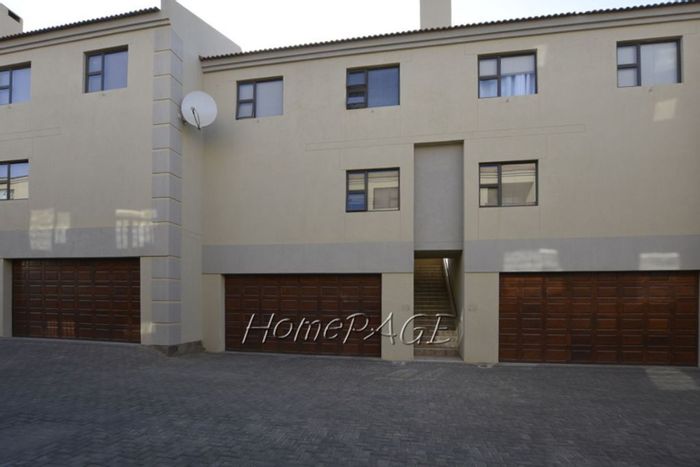 For Sale: Long Beach Townhouse with double garage, laundry, and beach access.