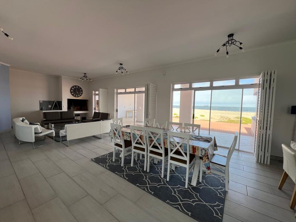 Lounge and dining room. Sliding doors leading to sea view patio 