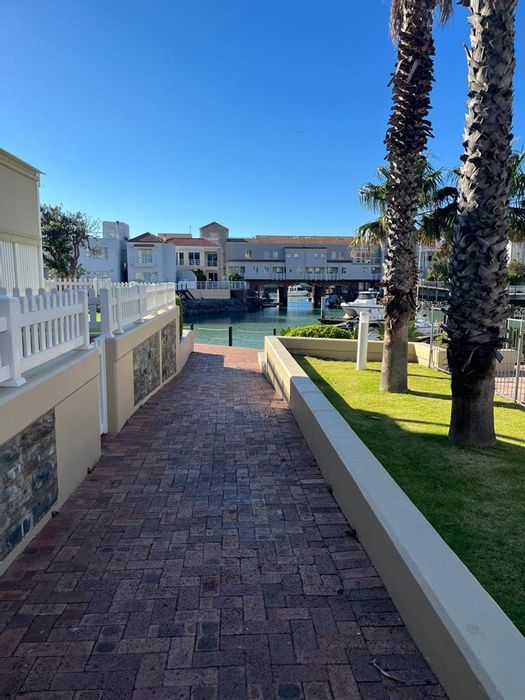 Harbour Island Apartment For Sale: Kitchen, private balcony, communal pool, marina access.