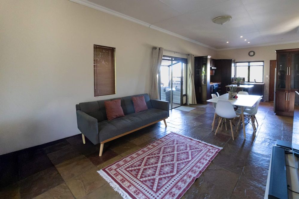 Open-plan living areas, kitchen and access to patio