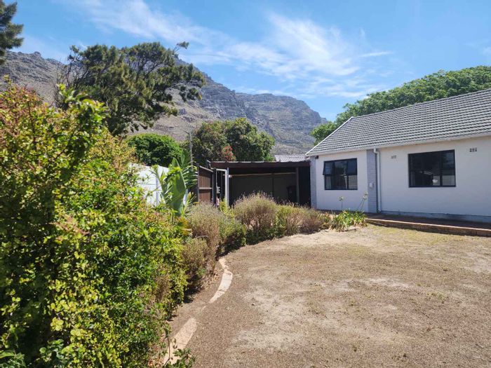 Lakeside House For Sale: Spacious home with pool, garage, and entertainment area.