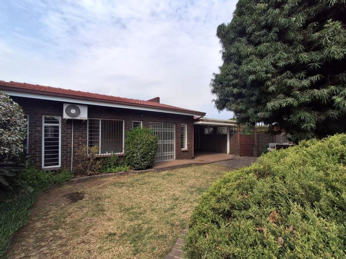 For Sale: Townhouse in Brackenhurst with private garden, double garage, and pool access.