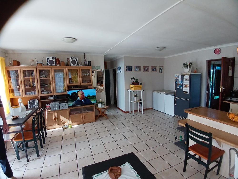 Same Main Living Area. Front door on our left. Kitchen on our right.