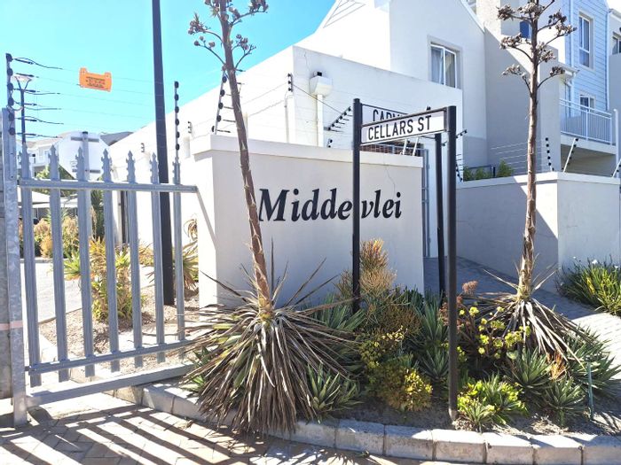 1-Bedroom Apartment To Rent in Burgundy Estate with patio, built-in braai, and parking.