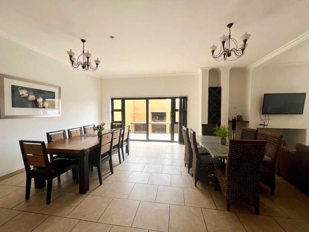 Dining area. Sliding doors leading to outdoor BBQ