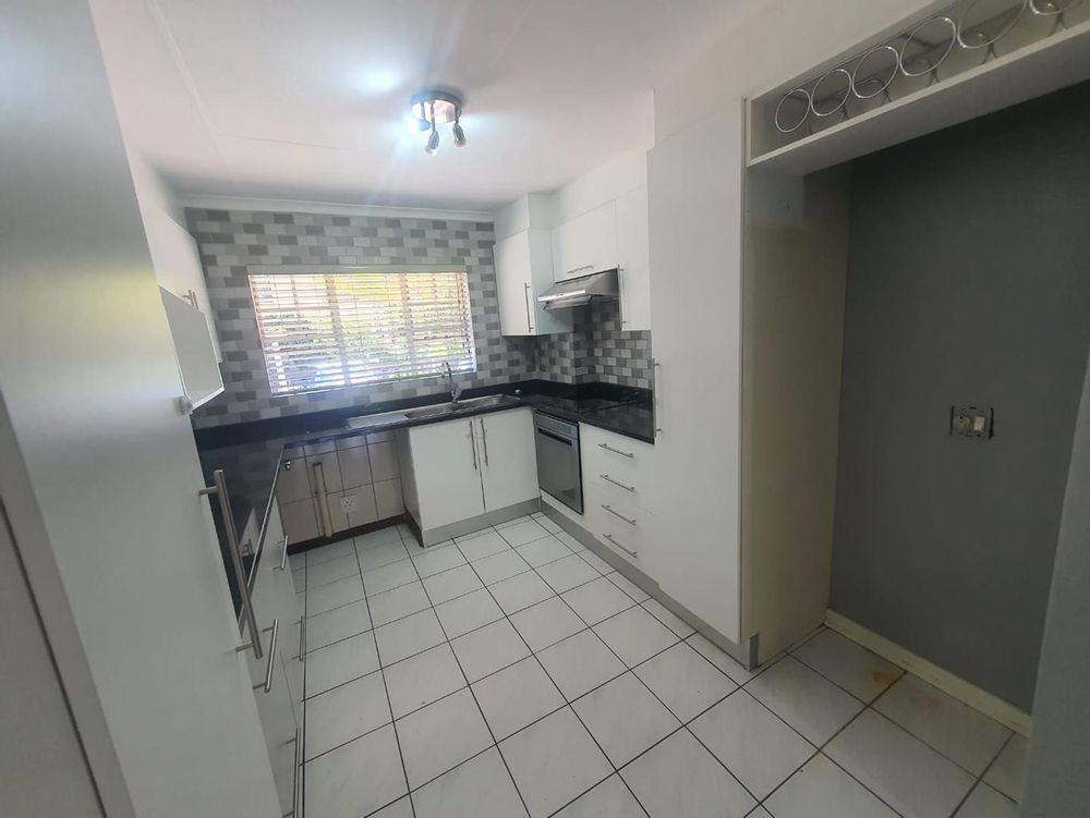 Modern kitchen with new oven and stove, washing machine /dishwasher or tumble dryer space