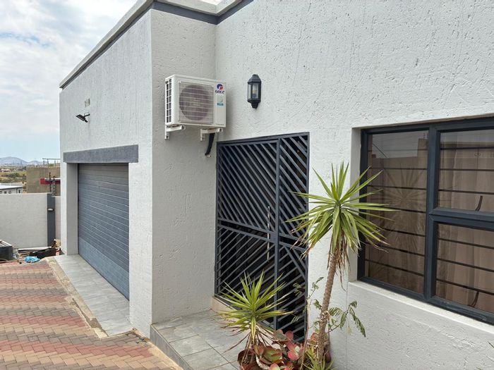 For Sale: House in Otjomuise with 3 bedrooms, double garage, and security features.