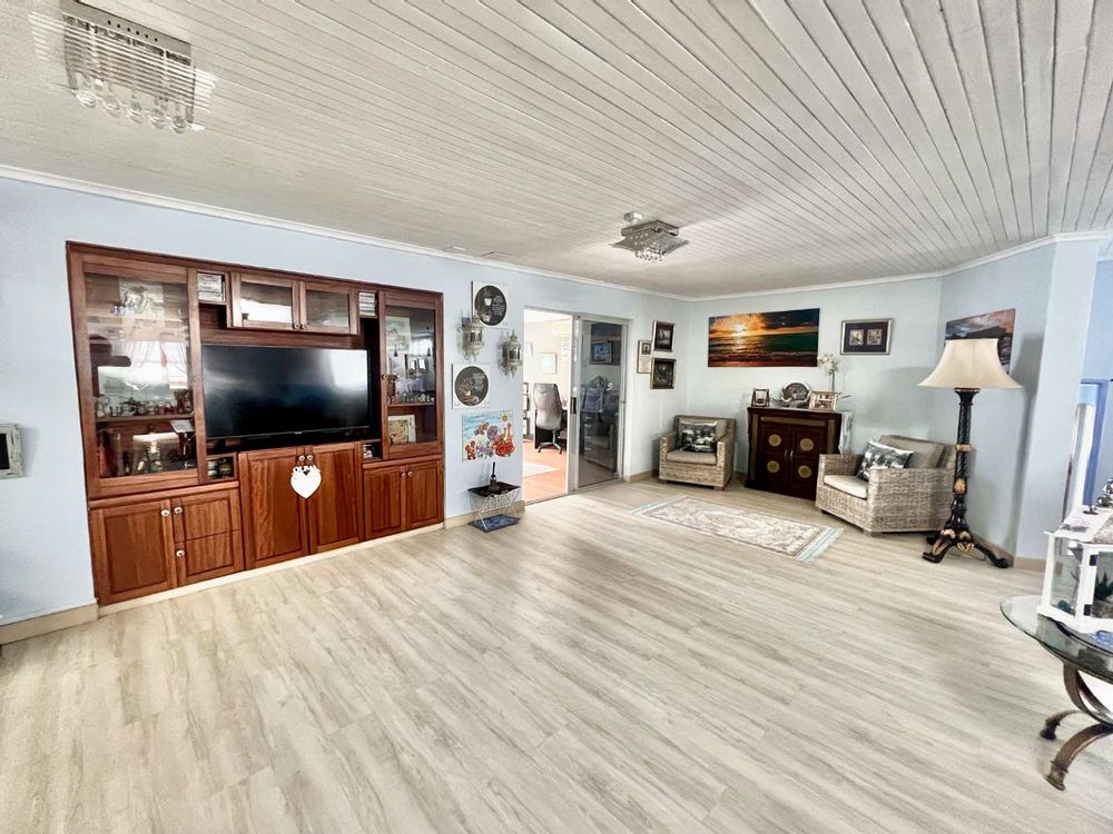 Large living room with built-in-braai and bar