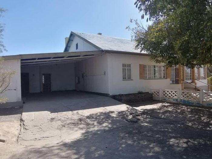 House for Sale in Keetmanshoop Central: Spacious, fenced, with borehole and storage.