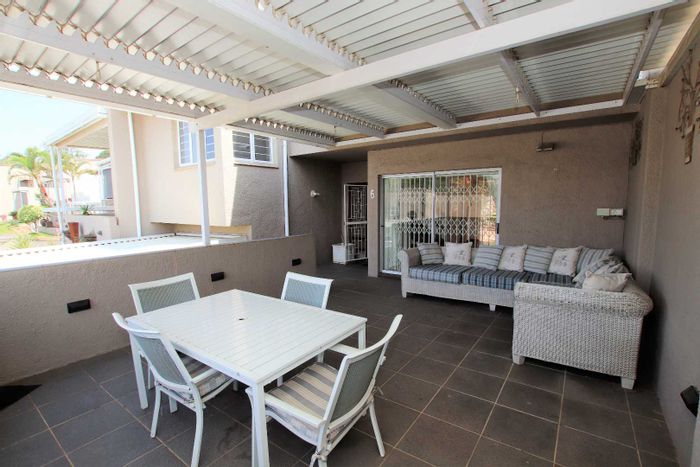 4-Bedroom Townhouse To Rent in Sunningdale with communal pool and spacious patios.