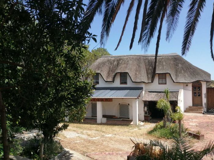 Somerset West Rural Small Holding For Sale: Multiple residences, koi ponds, and entertainment spaces.