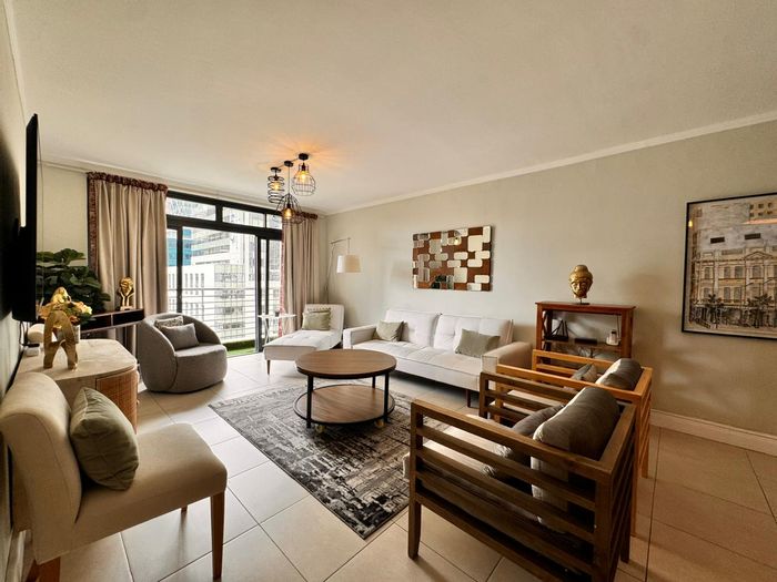 De Waterkant Apartment To Rent: Furnished, gym access, secure parking, city views.