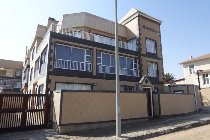 Furnished 2-bedroom apartment with lift, double garage, and security in Swakopmund Central. For Sale.