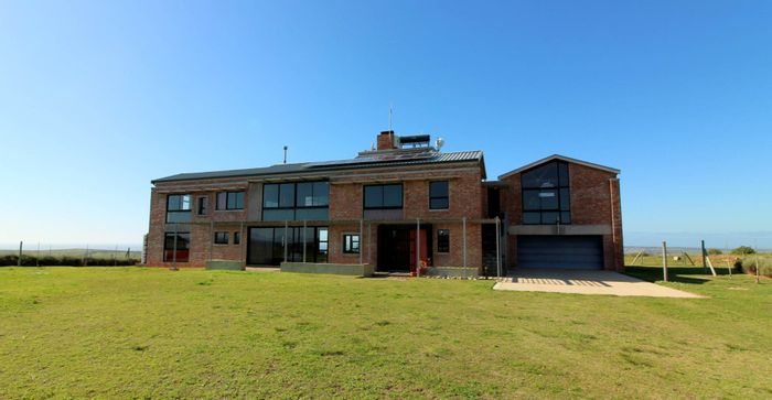 Farm for Sale in Mossel Bay Rural: 4-bed home, studios, solar power, outbuildings.