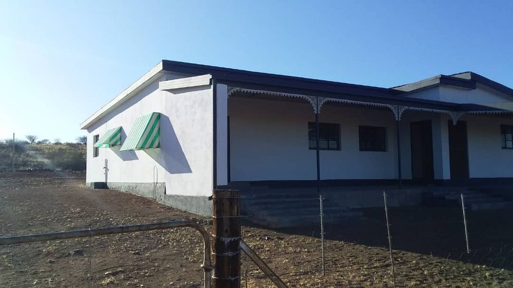 Front/side view of second house as well as a gate for entrance