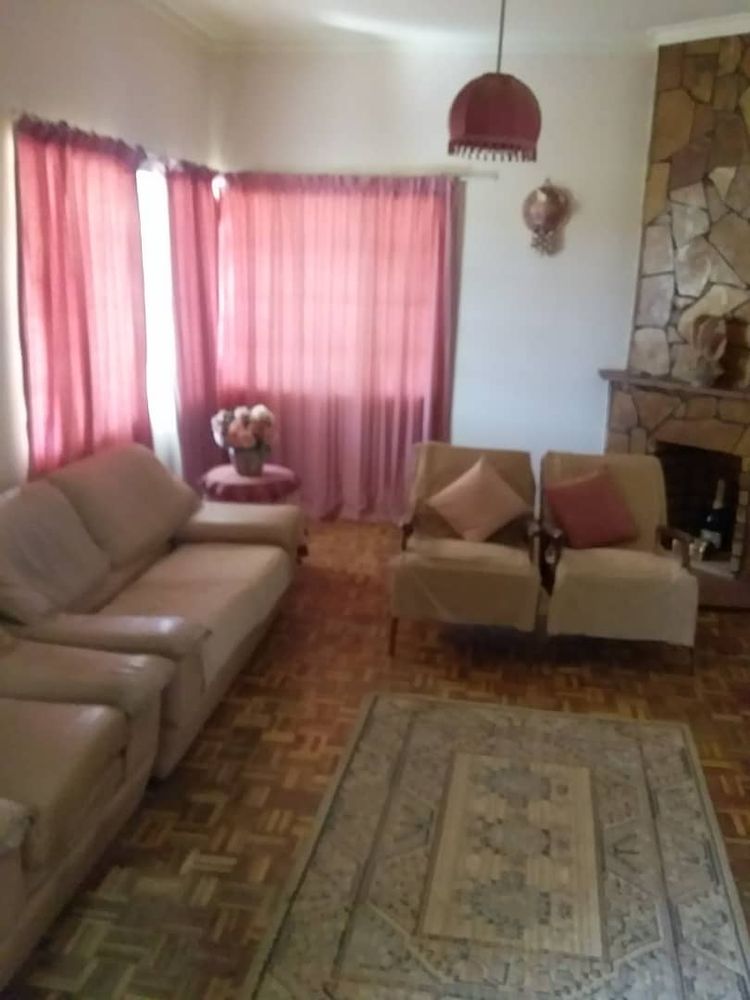 Main house- spacious living room and fire place