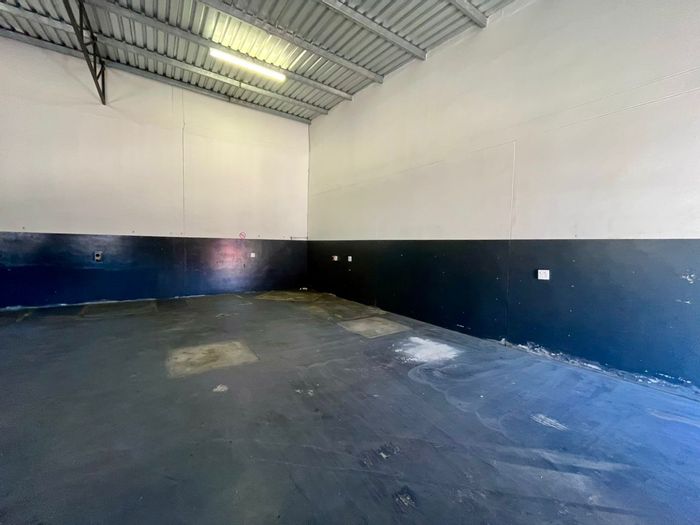 Industrial warehouse for rent in Swakopmund: 110sqm, 2 bathrooms, high garage door.