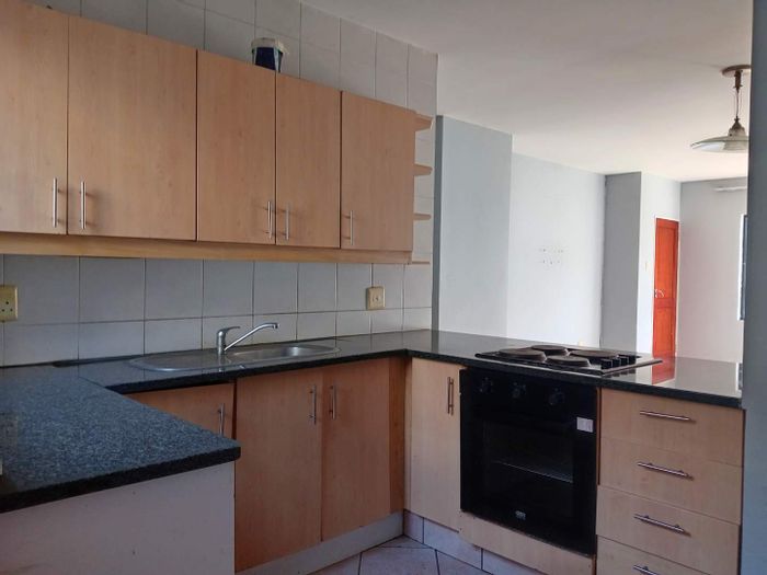 Two-bedroom apartment in Bedfordview Central with 24hr security and communal garden. To Rent.