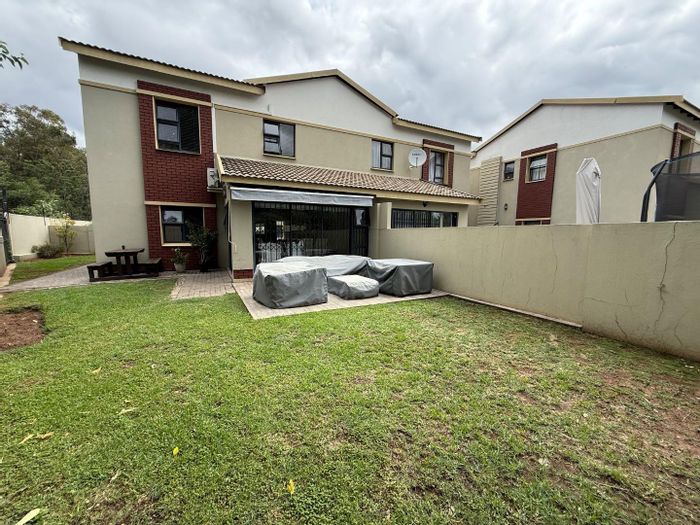 For Sale: Equestria Townhouse with 4 bedrooms, pool, clubhouse, and double garage.
