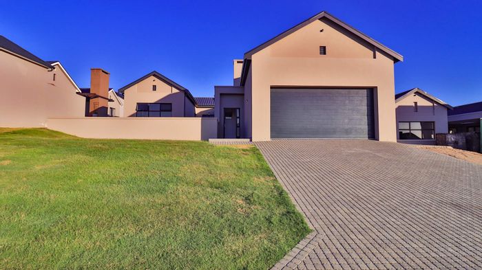 House For Sale in Hartland Lifestyle Estate: 3 bedrooms, patio, eco-friendly water tanks.