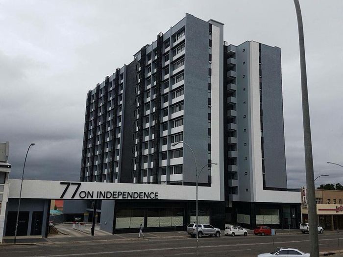 Windhoek Central Apartment For Sale: 2 beds, balcony, pool, gym, 24-hour security.