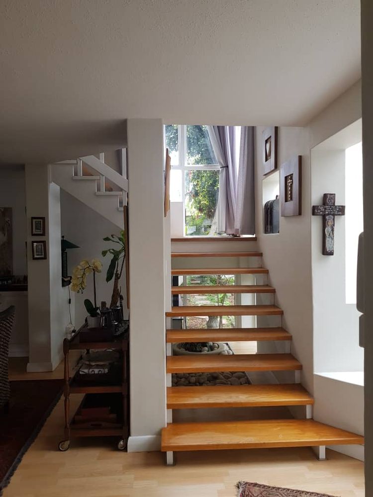 Stairs leading to the 4 bedrooms and bathrooms